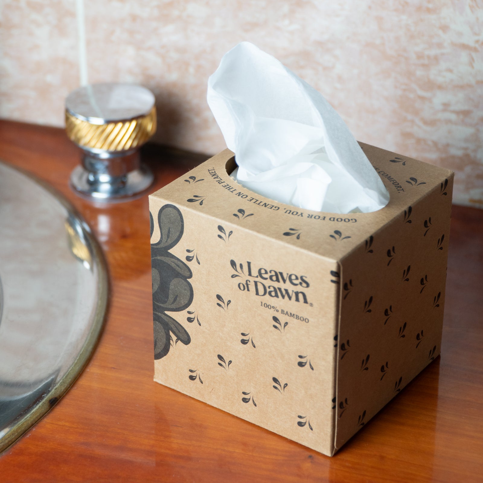 A box of Leaves of Dawn 3-ply bamboo facial tissues, a sustainable and gentle choice for sensitive skin.